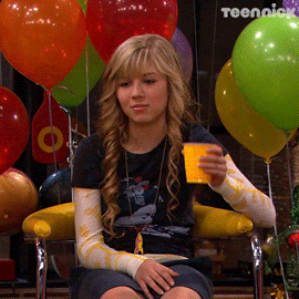 iCarly's Sam Puckett (played by Jeanette McCurdy) sarcastically cheering with a yellow solo cup in her hand.