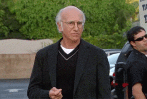 Larry David on Curb Your Enthusiasm with a face showing a worried look as the camera zooms in.