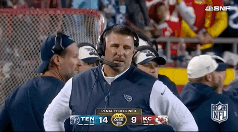 Former Tennessee Titans Head Coach Mike Vrabel is giving a look of disbelief as the camera zooms in on him during a Sunday Night Football game. The Titans lead the Chiefs 14 to 9 late in the first half, but the implication is that the Chiefs just declined a penalty.